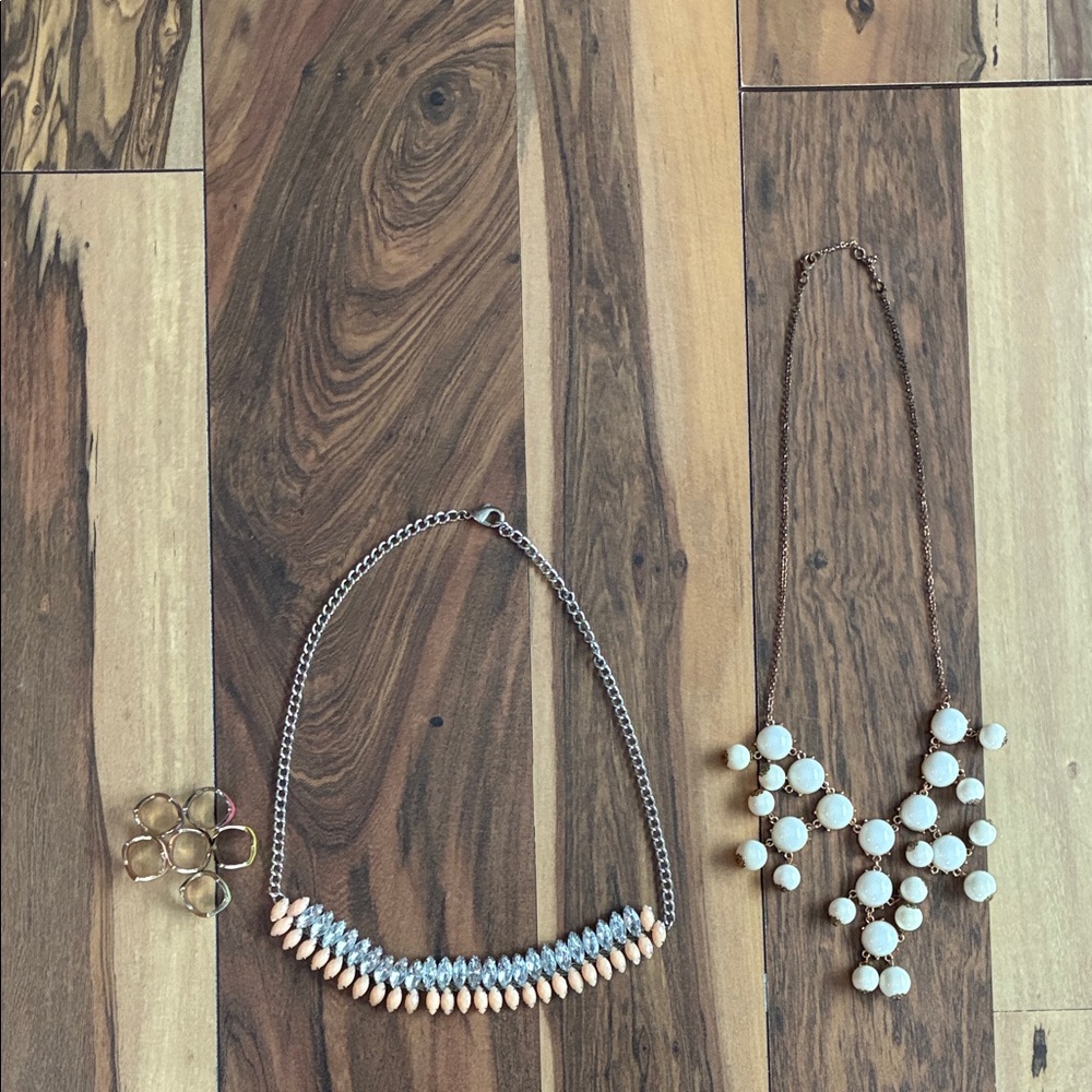 Two necklaces and set of six rings.